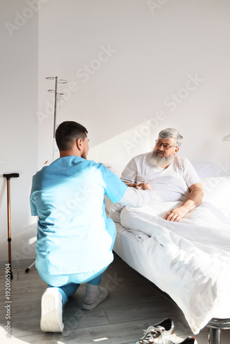 Senior man taking glass of ...