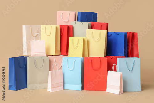 Many shopping bags on brown...