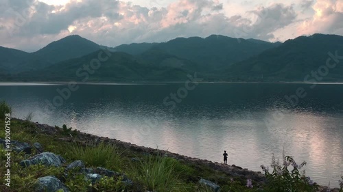 View of Colorful dramatic sky sunset or sunrise with Moving clouds background on River, Time lapse sky with cloud in nature and travel concept. High quality video nature foottage