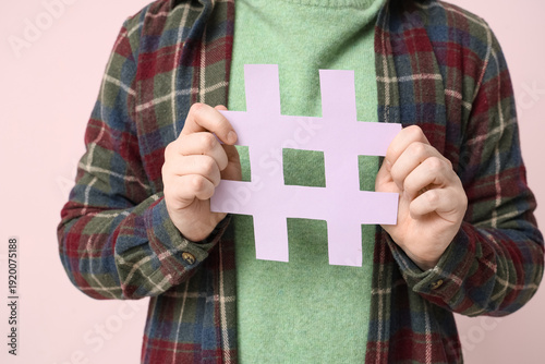 Man with hashtag sign on pi...