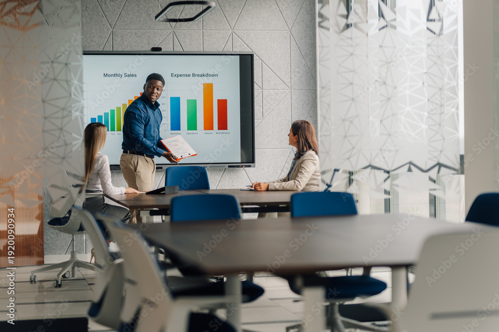 Fototapeta premium Business presenter showing sales data during meeting