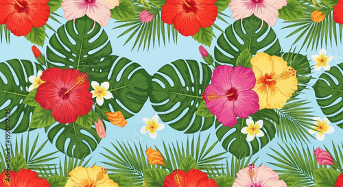 Tropical flowers and leaves pattern in a vibrant seamless design for textile or wallpaper