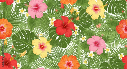 Vibrant tropical flowers and leaves pattern viewed from directly above in a lush environment