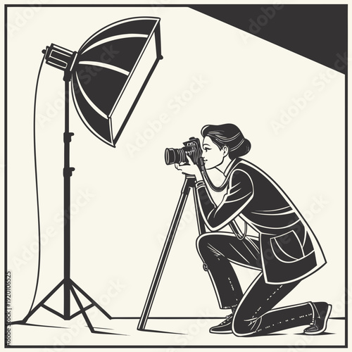 Photographer in action with studio light and camera.