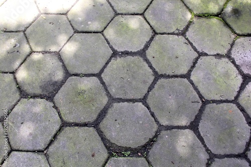 Top view close up of hexagonal paving blocks.
Hexagon-patterned concrete floor.
