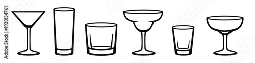 Collection of various drinking glasses and cocktail glasses in a line