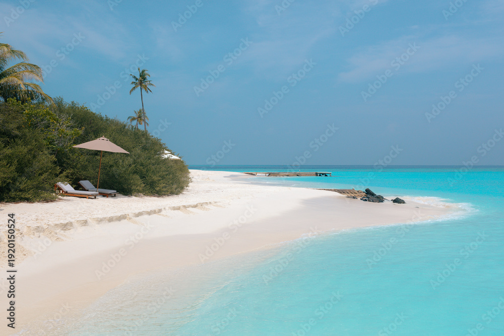 Fototapeta premium Vacation summer holidays leisure background - sunny tropical Caribbean paradise resort beach with white sand, lounger, palms on Maldive