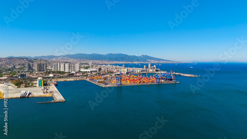 Wallpaper Mural Izmir, Turkey. Aerial view of Izmir Port container terminal with stacking area and large cranes for cargo operations on sunny summer day. Aerial view. Torontodigital.ca