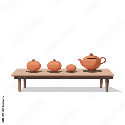 Traditional brown ceramic tea set on a wooden table.