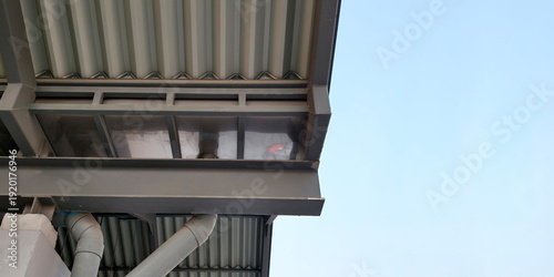 Fotografie Modern industrial roof structure featuring gray corrugated metal sheets sturdy s