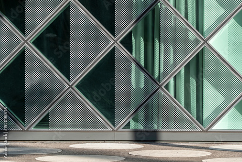 Abstract urban facade in modern glass showing geometry grid pattern and rich texture made for a clean background with corporate feel and generous copy space
