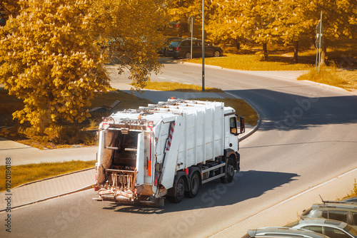 Fotografie Truck with lifting arm transporting garbage