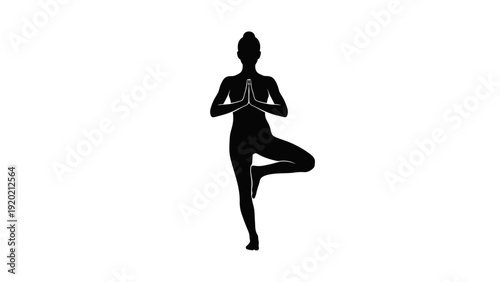 Silhouette of Woman Practicing Yoga in Tree Pose.
