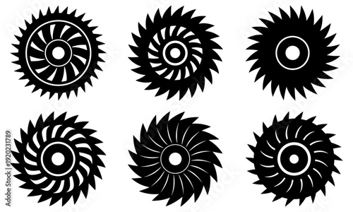 Collection of black circular saw blades with sharp teeth arranged in two rows on a plain surface