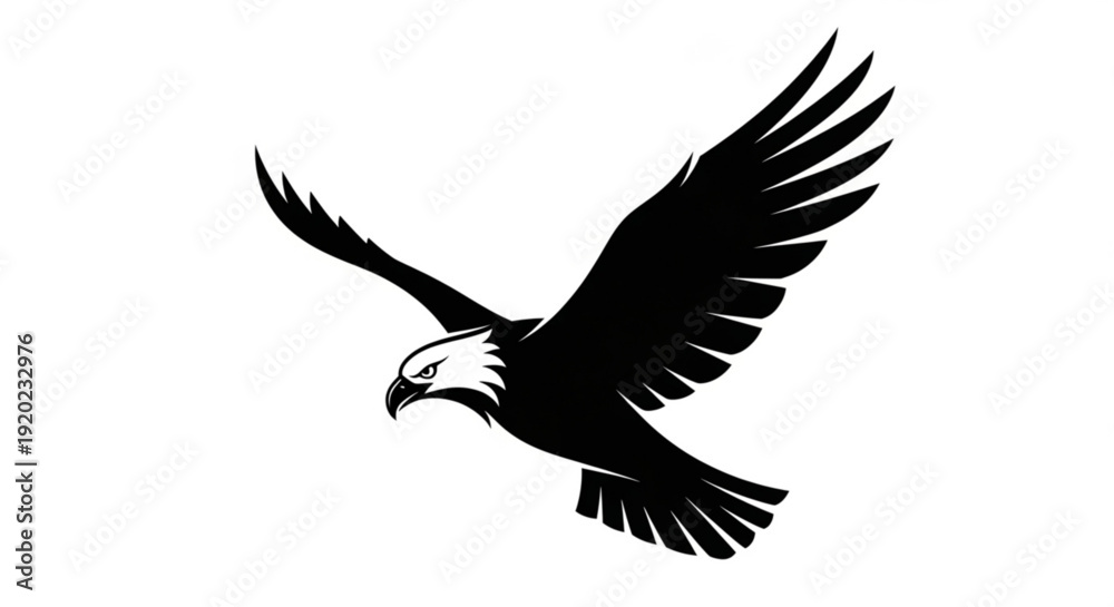 Obraz premium Black silhouette of an eagle in mid flight with outstretched wings on a white background