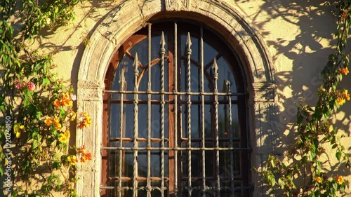 Eid celebrations bring people together outside a grilled window