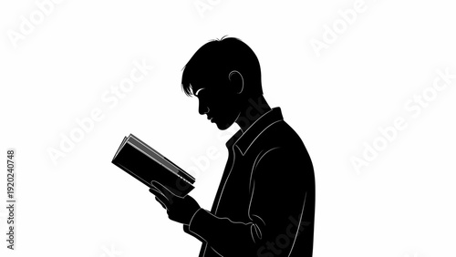 Silhouette of a Man Reading a Book in Profile.