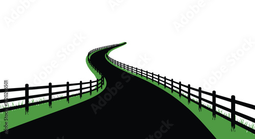 A winding road with a black fence stretches into the distance