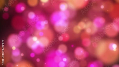 An abstract background with a soft bokeh of blurred glowing circles in warm pink and orange tones.