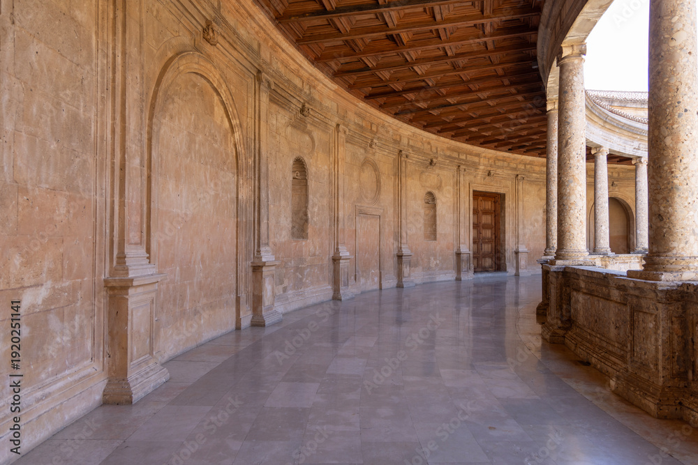 Fototapeta premium Circular patio of Palace of Charles V, renaissance building inside fortress Alhambra, Granada, Spain, Andalusia