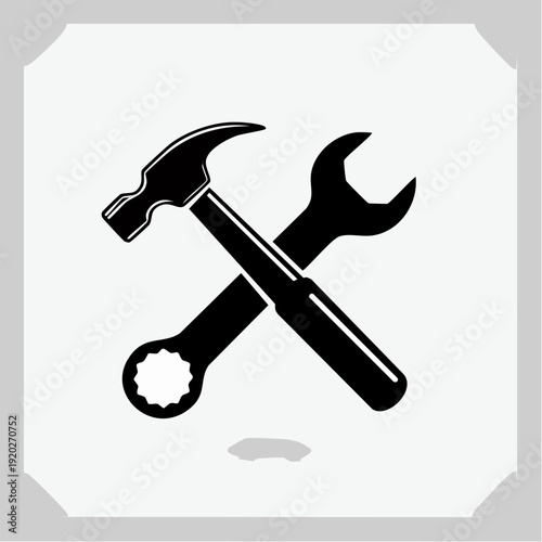Icon representing tools a hammer and wrench crossed, symbolizing repair, construction, and DIY projects