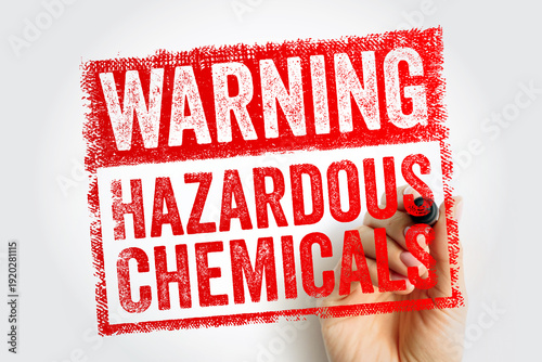 Wallpaper Mural WARNING HAZARDOUS CHEMICALS stamp held by a hand. Safety notice for industrial or laboratory environments indicating toxic substances, risk of poisoning, and chemical hazards Torontodigital.ca
