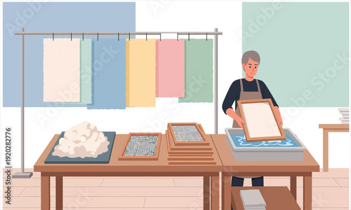 A Person making handmade paper sheets in a workshop