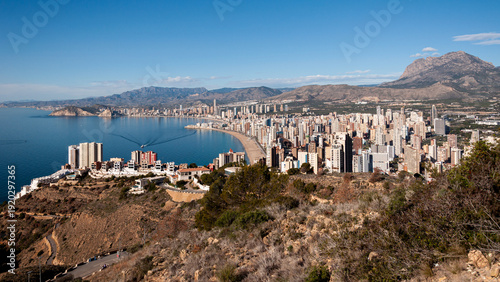 A panoramic view of the Spanish town of Benidorm from above looking down on the twin bays and high rise buildings