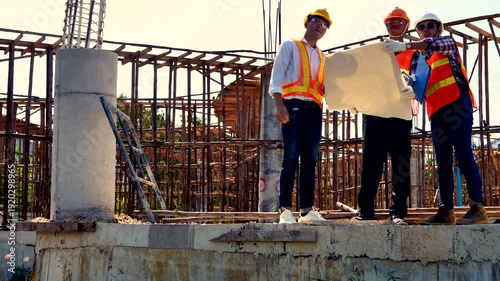 Structural engineer, architect and foreman worker with blueprints discuss, plan working for the outdoors building construction site. Construction collaboration concept. 4K