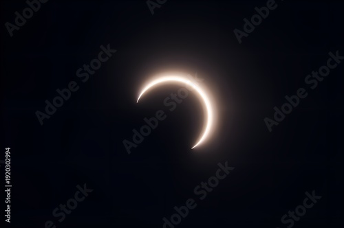 Partial Solar Eclipse Against Dark Sky