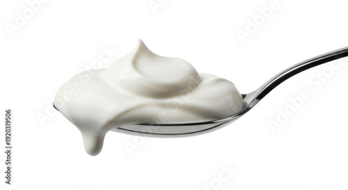A spoonful of fresh, creamy white yogurt or sour cream with a delicate drip, isolated on a clean white background. Perfect for food concepts.