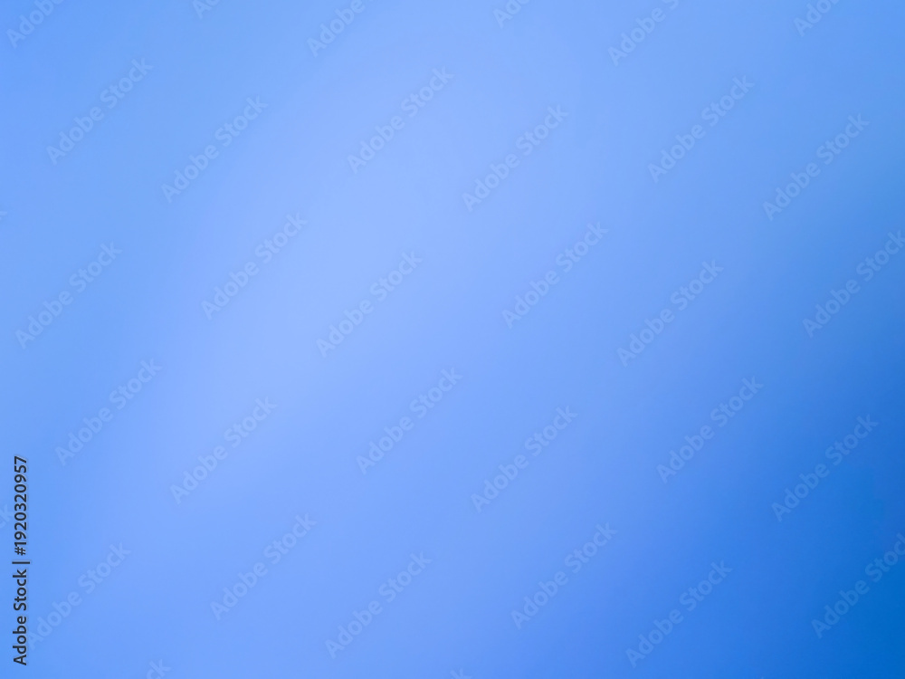 Naklejka premium The photograph, taken with a camera, has a background color tone of blue and navy. The image contains white with shades of light blue, navy, dark blue, and black, creating a gradient of colors and lig