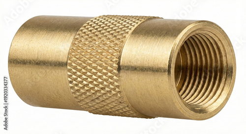 Extreme macro of a solid brass tire deflator tool with knurled grip and internal threads on white background.