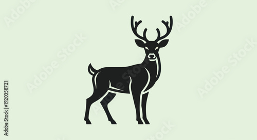 Stylized Black Deer Silhouette with Antlers on Light Green Background
