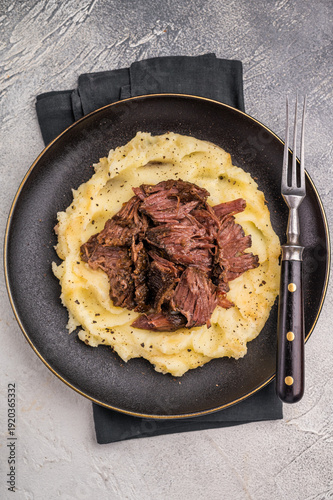 Slika na platnu German Braised Beef Cheek, Slow cooked meat with smashed potatoes on a plate