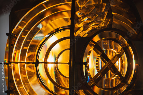 Wallpaper Mural Lighthouse lamp with Fresnel lens mounted on metal frame glow in the dark, close up photo with soft selective focus Torontodigital.ca