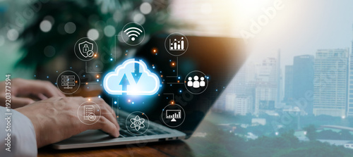 Obraz na płótnie Business professional using laptop with cloud computing interface, data storage, cybersecurity, analytics and global network connection, digital transformation and smart technology concept