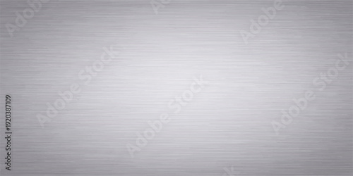 Stainless brushed metal texture plate with a shiny silver metallic steel surface and gray aluminum material pattern for a textured industrial backdrop wallpaper
