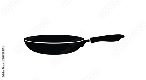 A simple black frying pan depicted in a stark silhouette