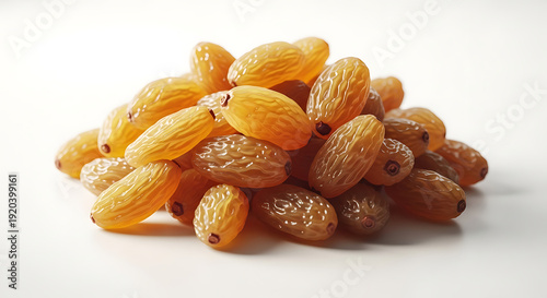 Golden raisins piled on white background dried fruit heap for healthy snacking and baking