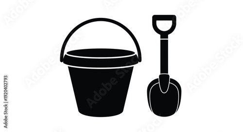 Black silhouettes of a bucket and shovel depict beach play silhouette