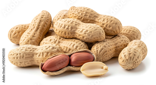 A pile of peanuts with one cracked open on a white background showcasing texture and shell details
