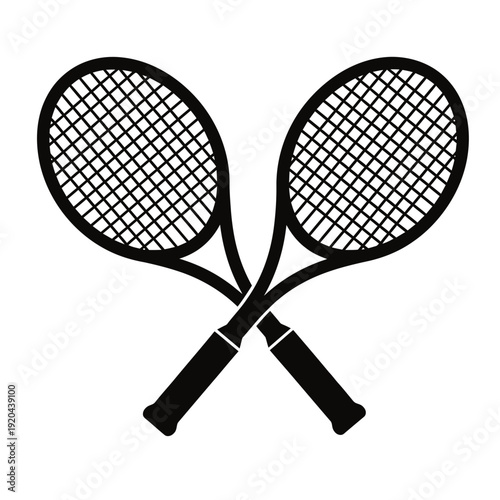 Two black tennis rackets crossed over each other