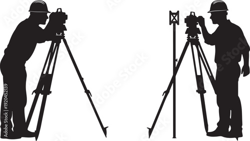 Two surveyors in hard hats operating theodolites on tripods surveying construction engineering equipment
