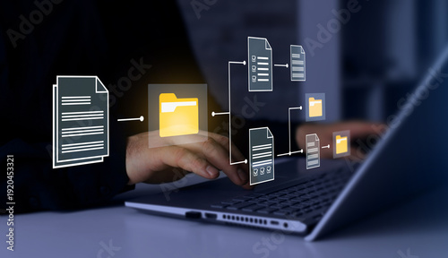 Tableau sur toile Business professional working on laptop with virtual document management system interface