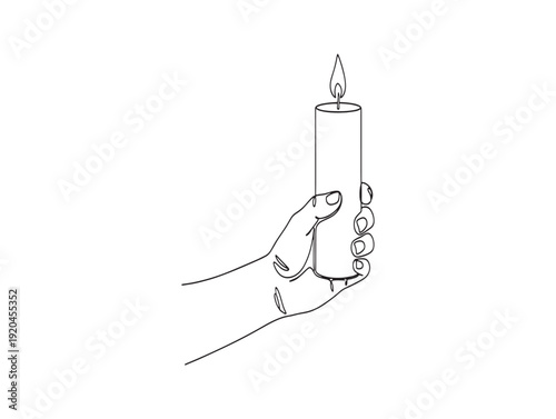 A hand holding a lit candle with a flame burning brightly on top
