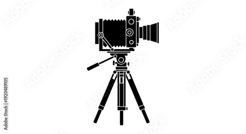 Vintage film camera on tripod.