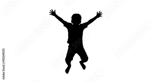 Joyful Silhouette of a leaping Child: A carefree silhouette captures a young child leaping in the air, arms outstretched in a moment of unbridled joy and freedom. 