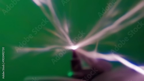 Hand Emitting Bright Light Rays on Green Screen Background.