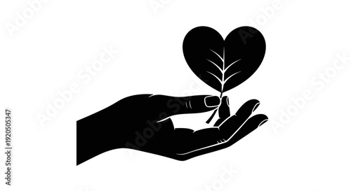 Hand Holding Heart Shaped Leaf Silhouette.